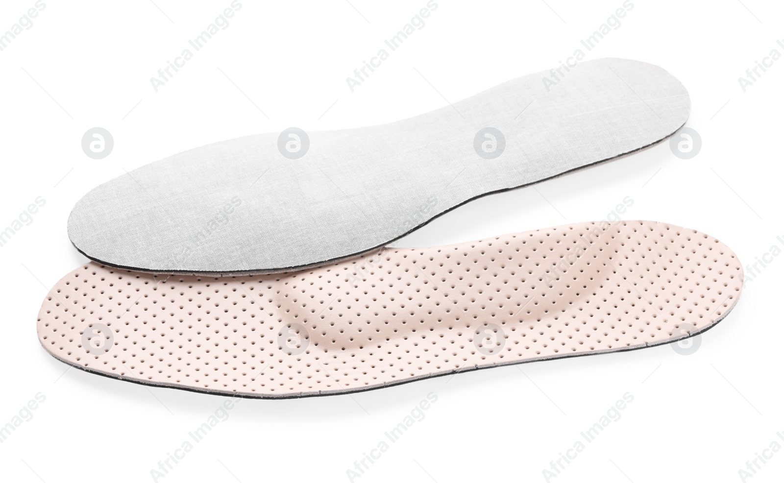 Photo of Beige comfortable orthopedic insoles isolated on white