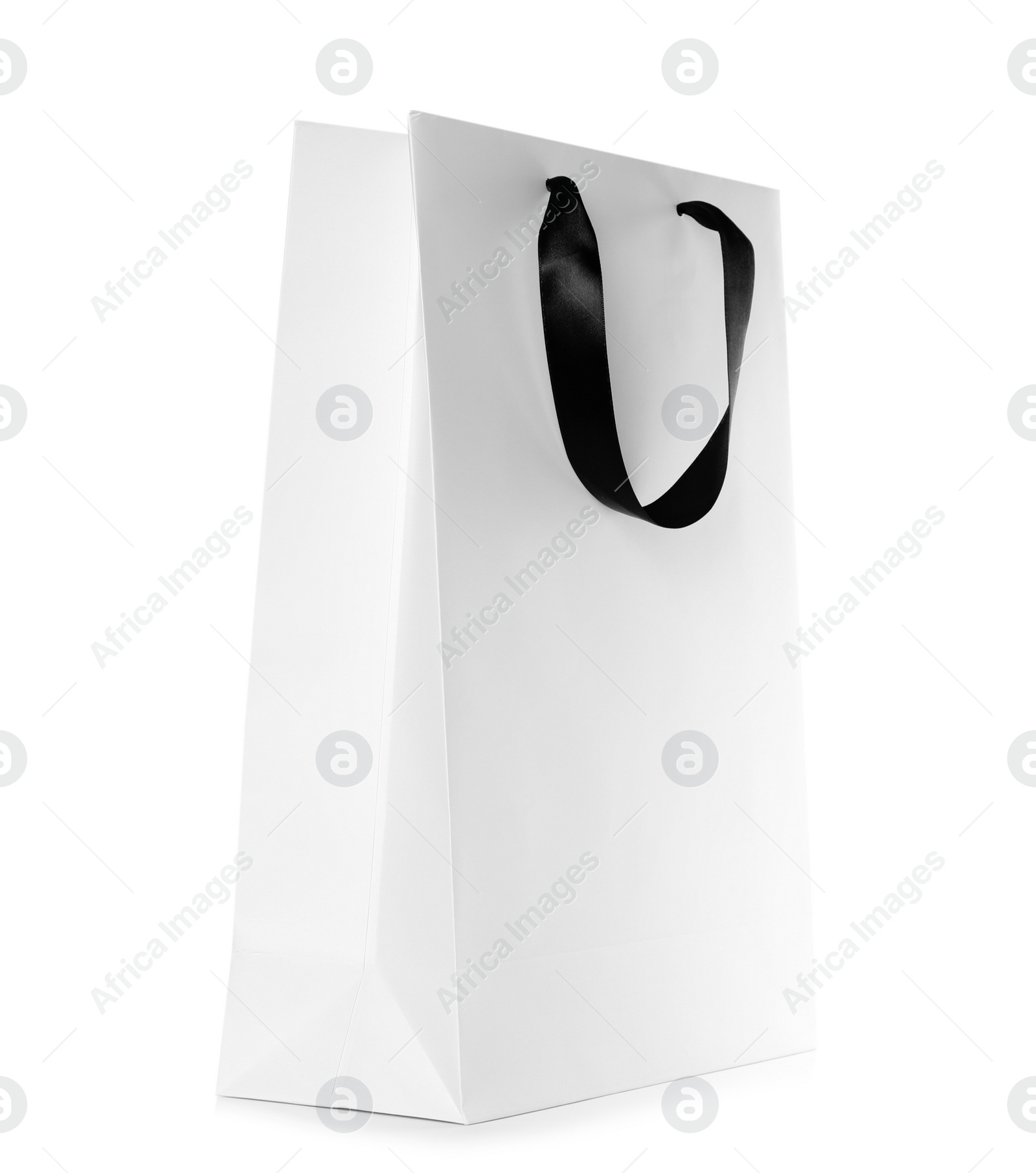 Photo of Paper shopping bag isolated on white. Mock up for design