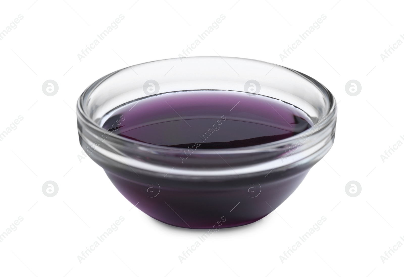 Photo of Glass bowl with purple food coloring isolated on white