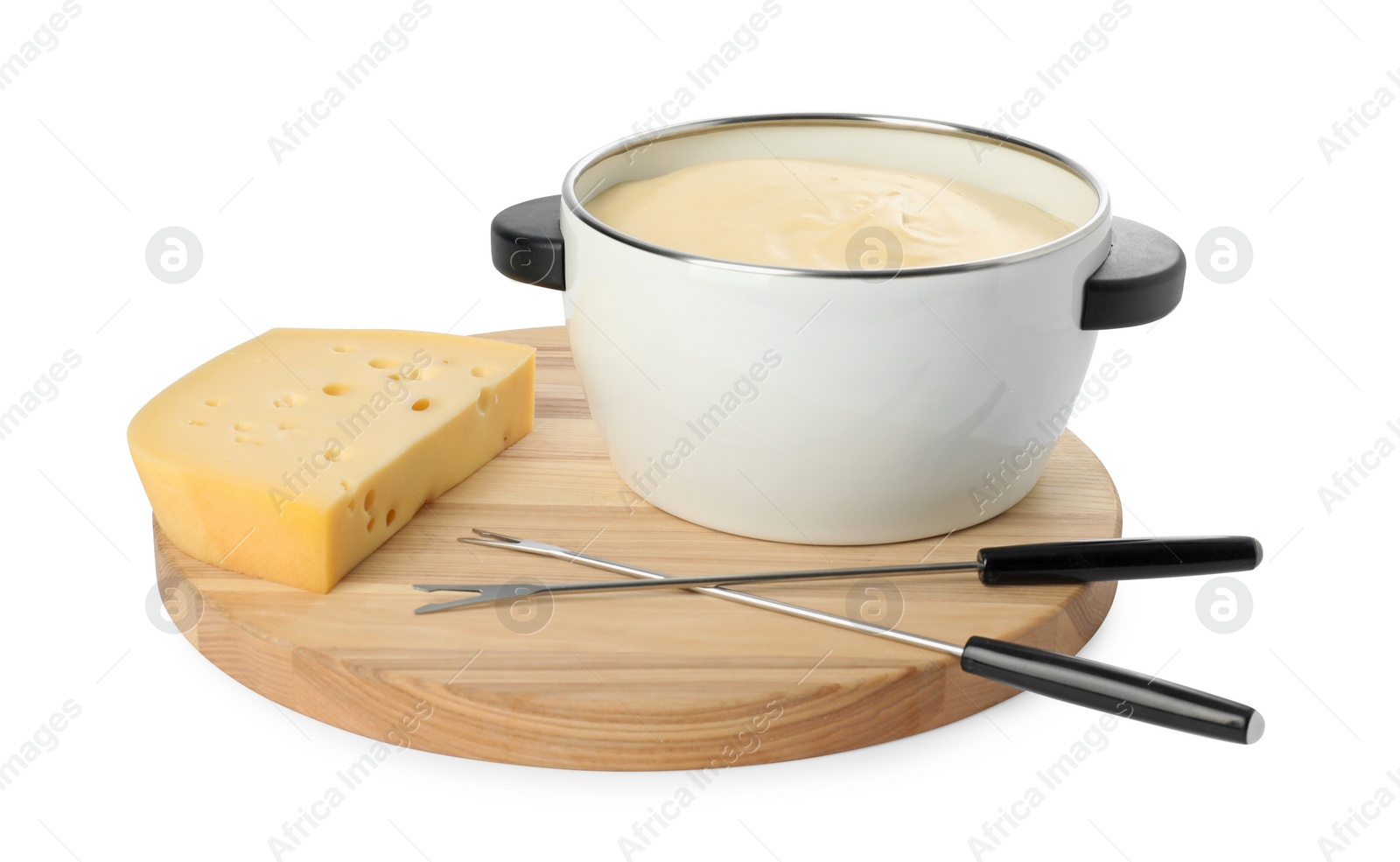 Photo of Fondue with tasty melted cheese, forks and piece isolated on white