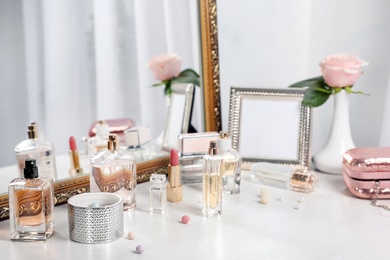 Photo of Perfume bottles on dressing table