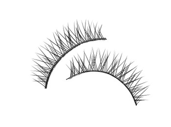 Fake eyelashes on white background, top view. Makeup product