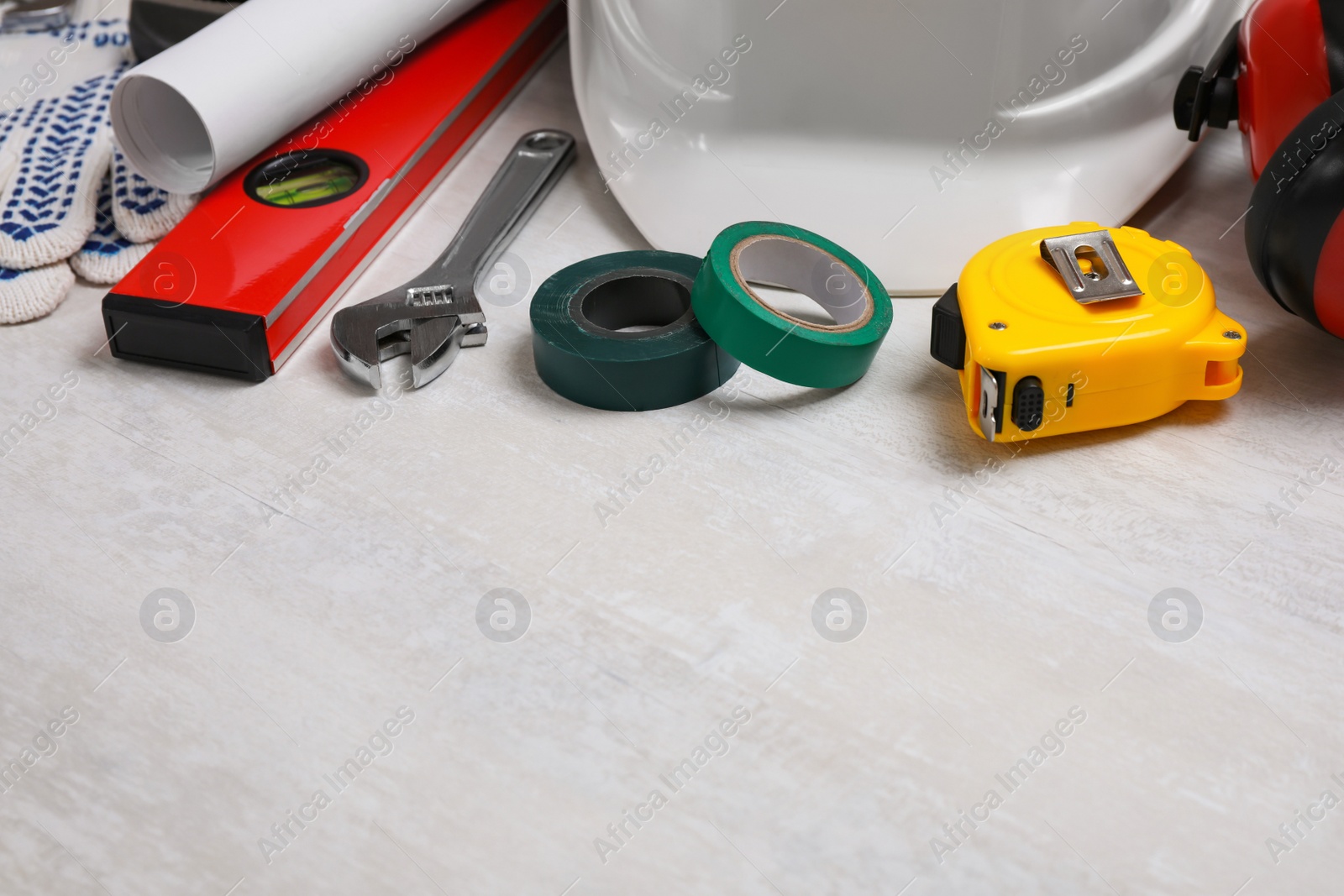 Photo of Different construction tools on light background. Space for text