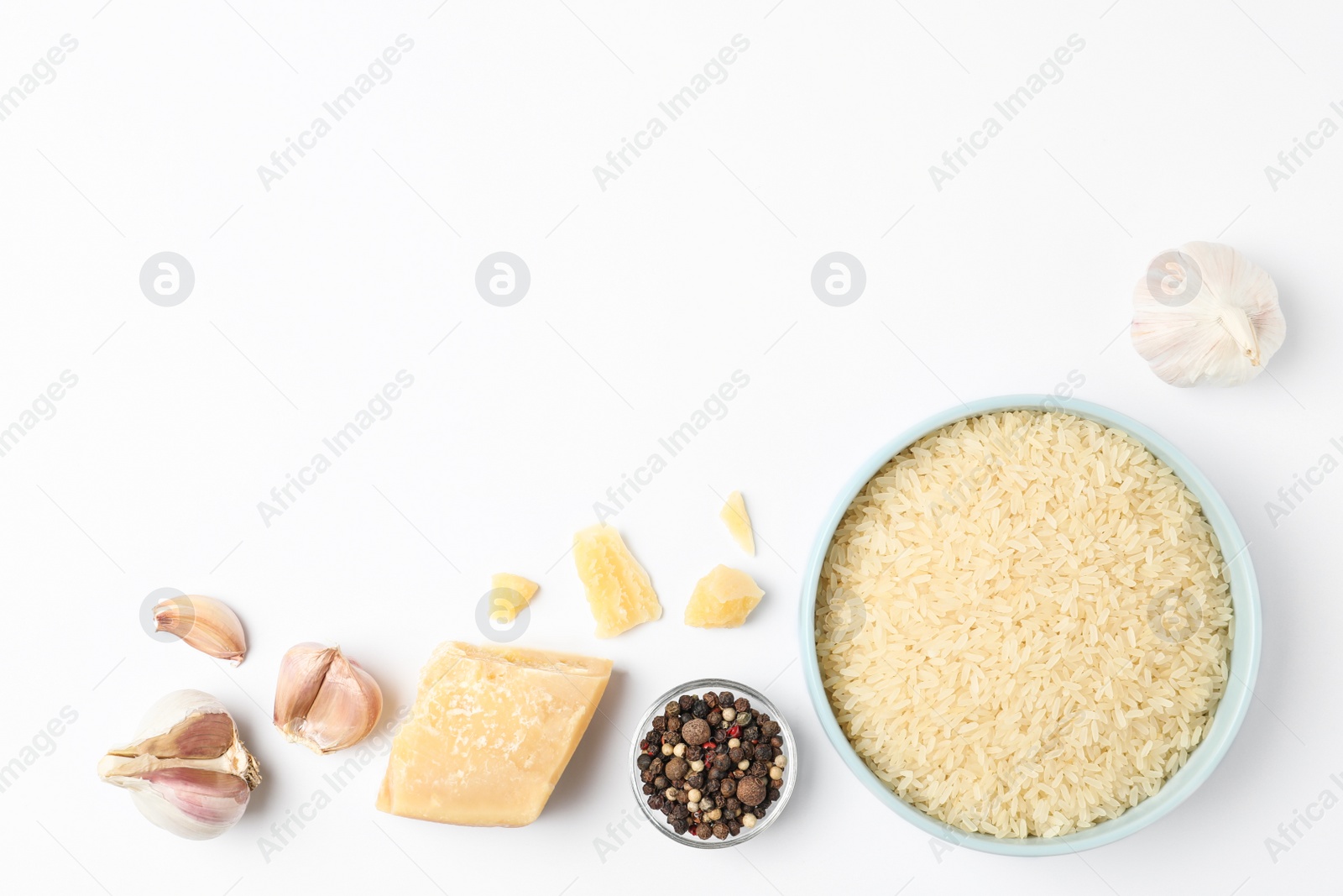 Photo of Different ingredients on white background, top view. Risotto recipe