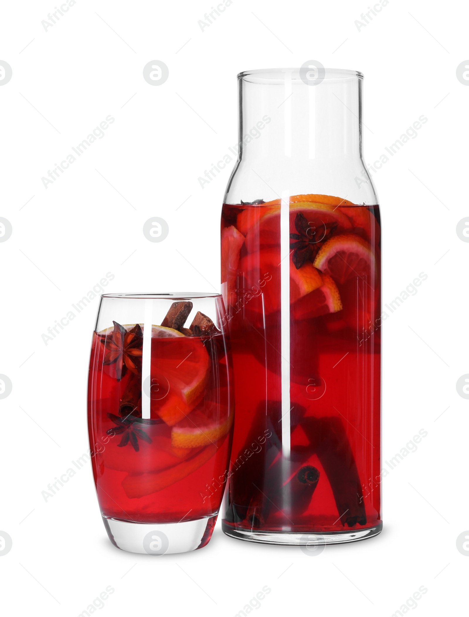 Photo of Jug and glass with tasty punch drink isolated on white