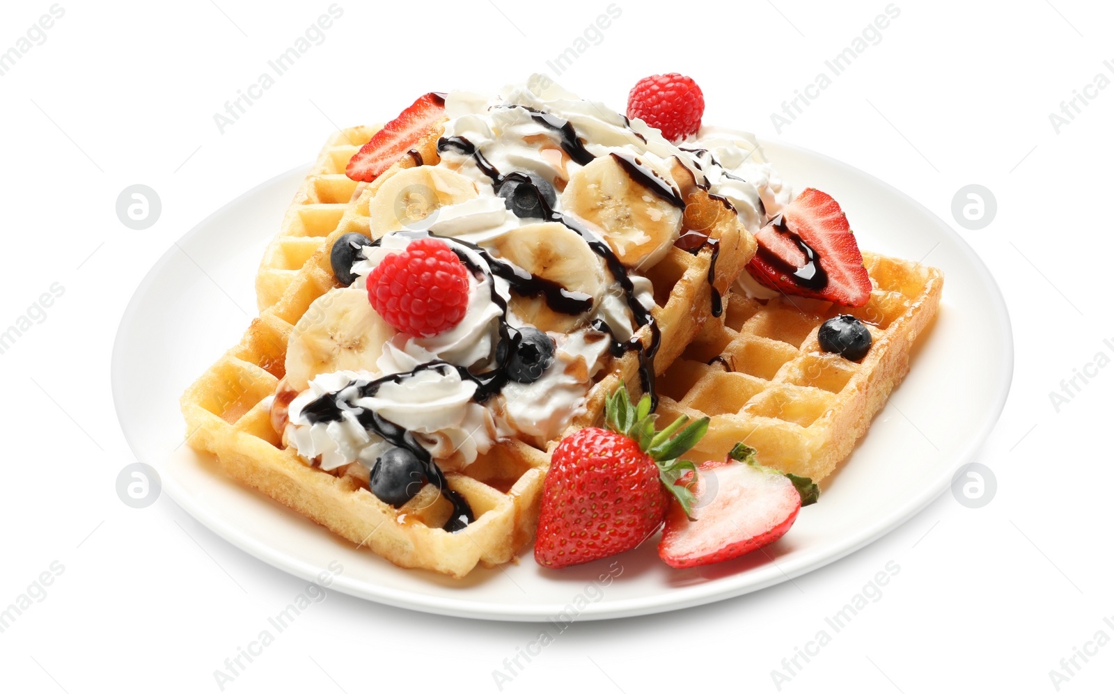 Photo of Plate with yummy waffles, whipped cream and berries on white background