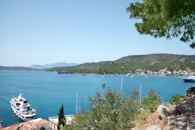 Photo of Beautiful view of coastal city with boats on sunny day