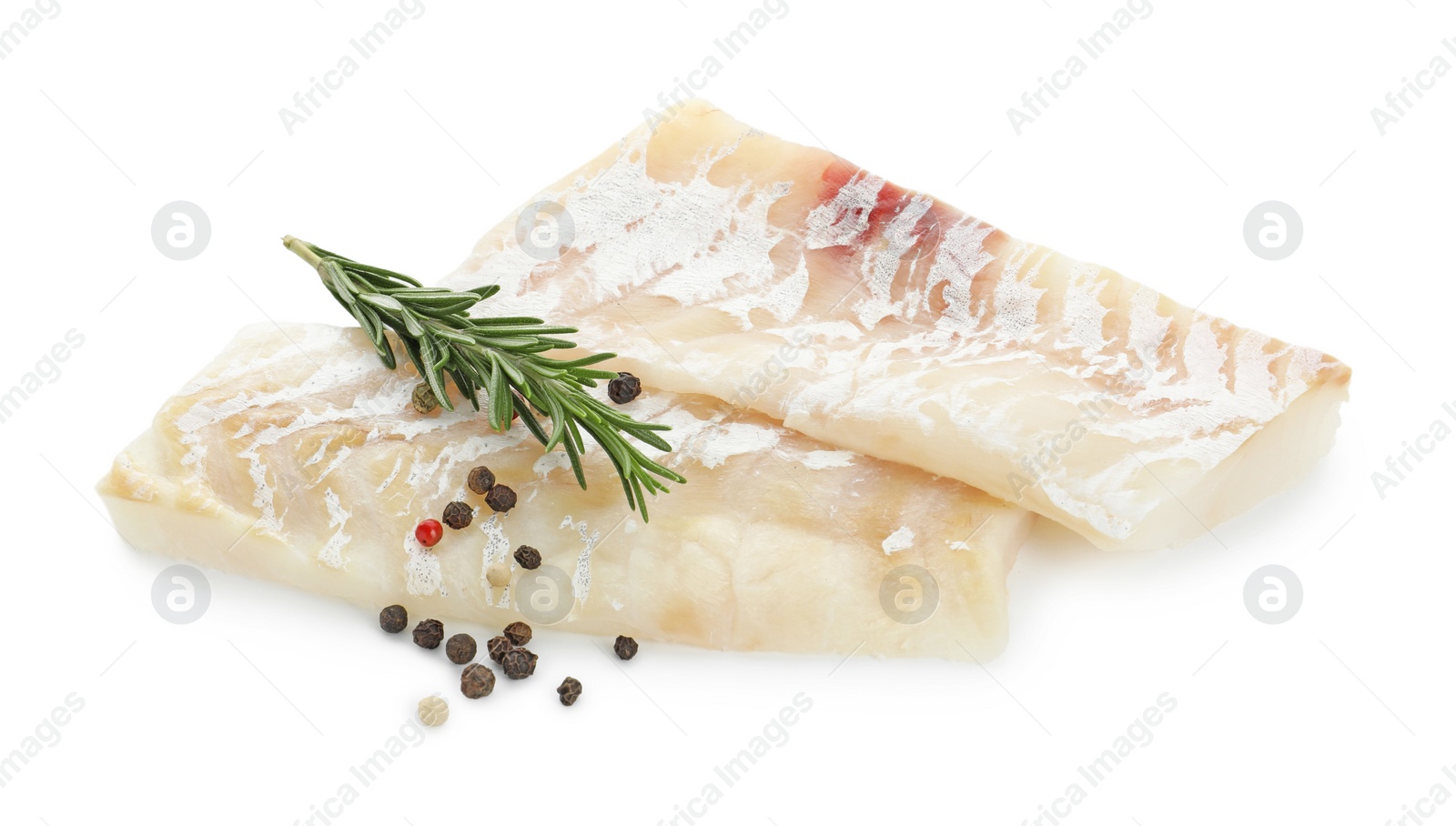 Photo of Fresh raw cod fillets with rosemary and peppercorns isolated on white