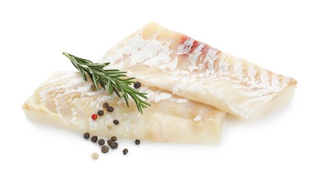 Fresh raw cod fillets with rosemary and peppercorns isolated on white