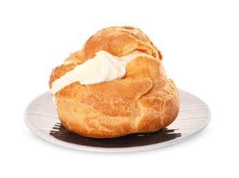 Photo of Delicious profiterole with cream filling isolated on white