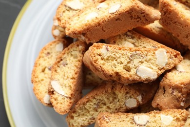 Photo of Traditional Italian almond biscuits (Cantucci) on plate, closeup