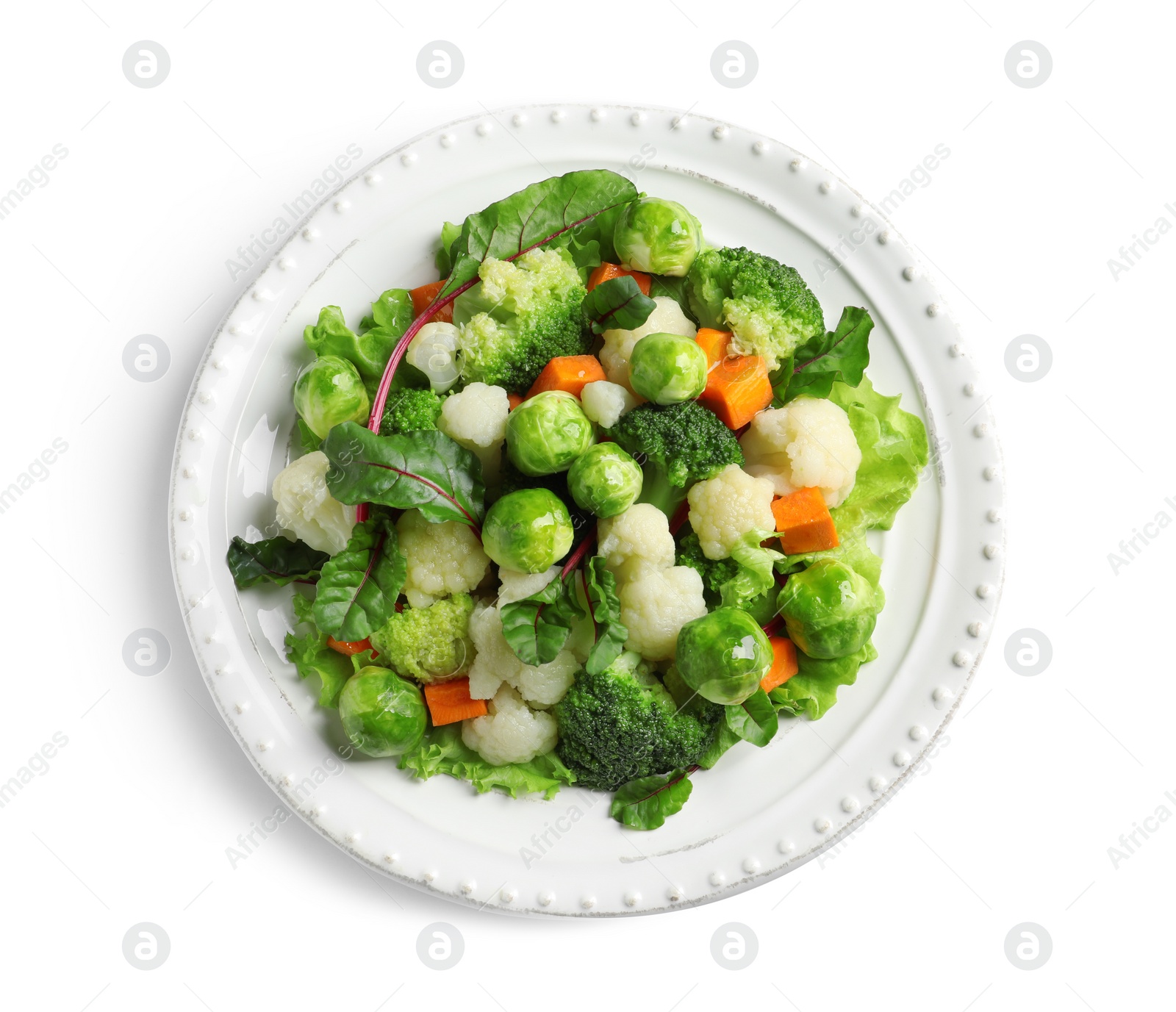 Photo of Plate of salad with Brussels sprouts isolated on white, top view