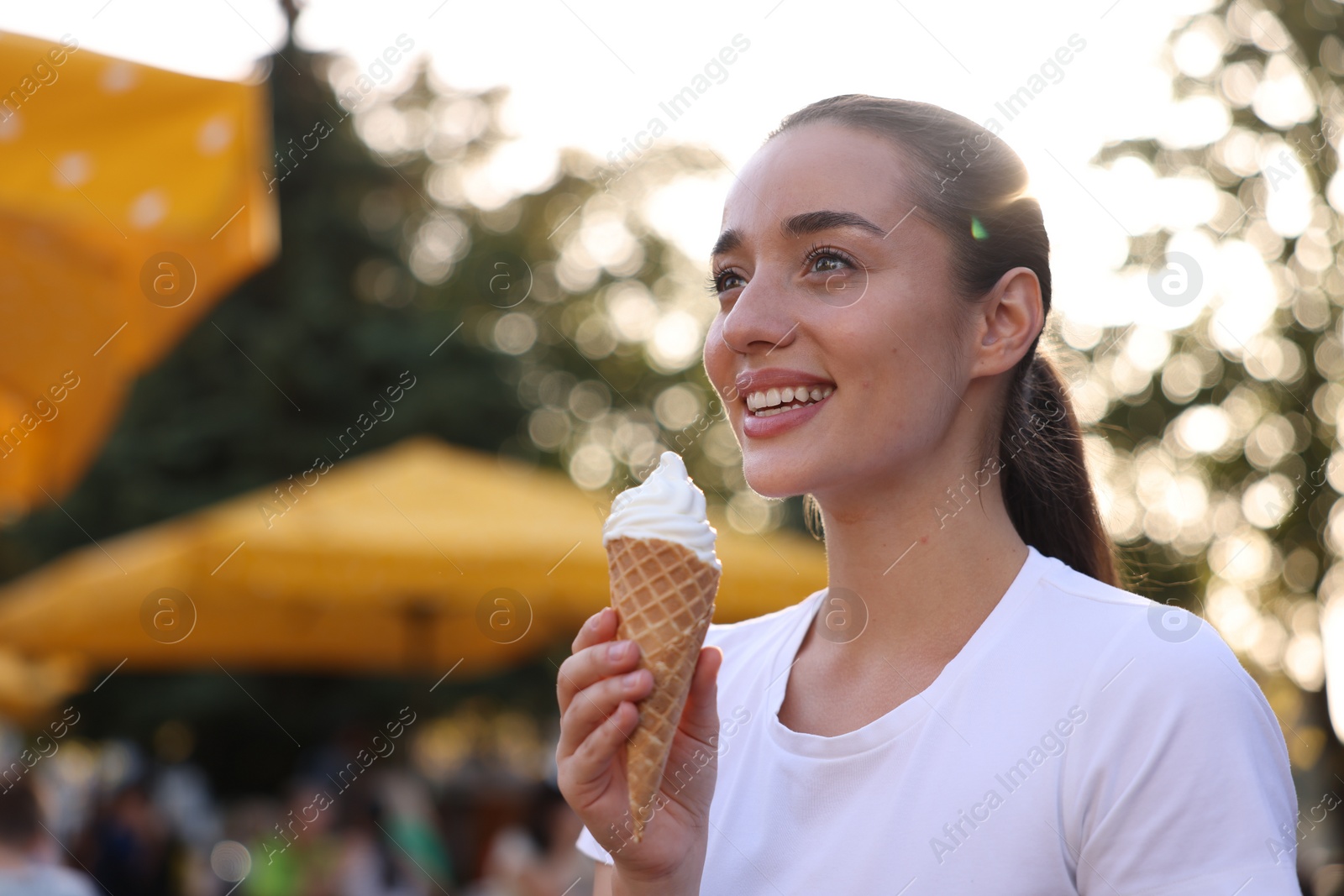 Photo of Lviv, Ukraine - September 26, 2023: Woman with McDonald's ice cream outdoors, space for text