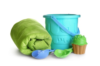 Photo of Set of plastic beach toys and towel on white background