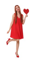 Photo of Young woman in red dress with paper heart on white background