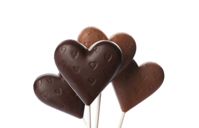 Photo of Heart shaped lollipops made of chocolate on white background