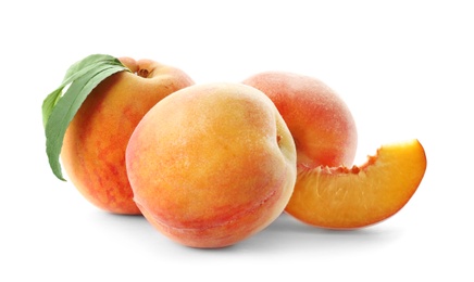 Fresh sweet peaches on white background