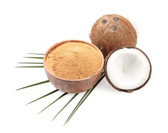 Coconut sugar in bowl, fruits and palm leaf isolated on white