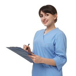 Portrait of smiling medical assistant with clipboard on white background