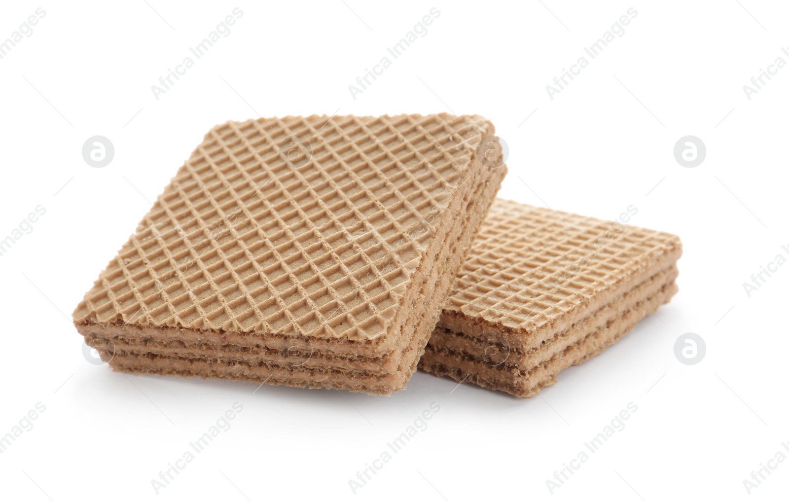 Photo of Delicious crispy wafers on white background. Sweet food