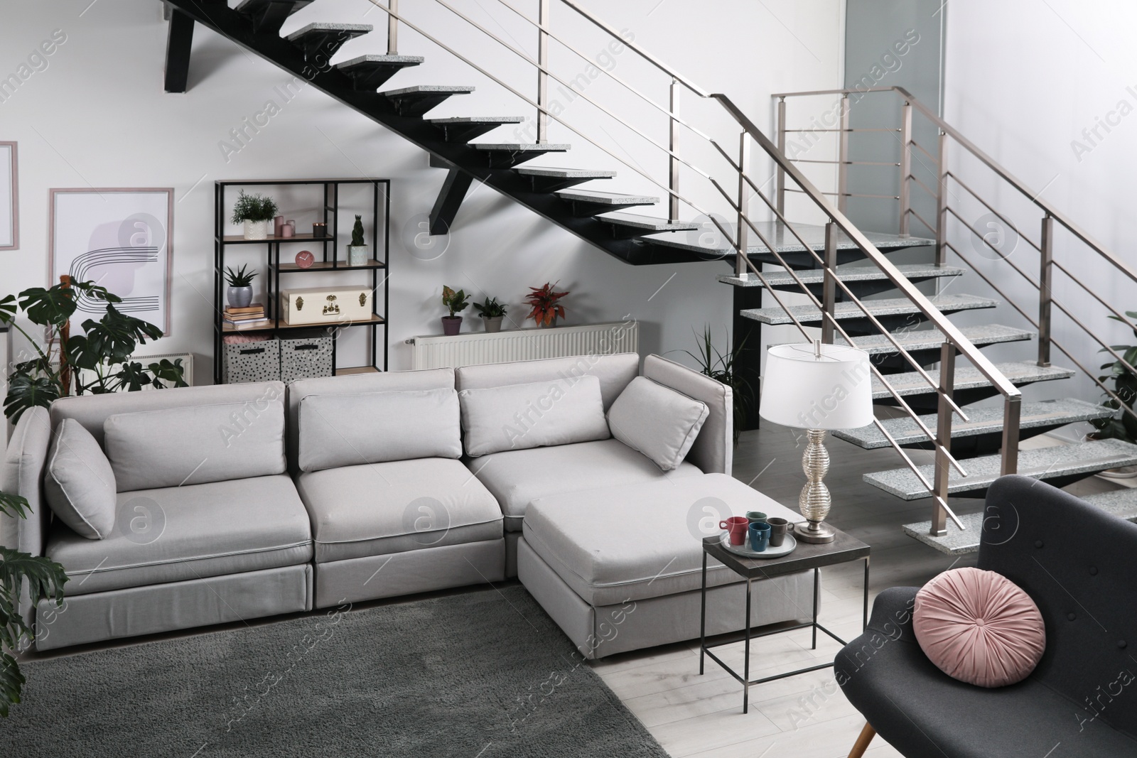 Photo of Stylish living room interior with comfortable sofa