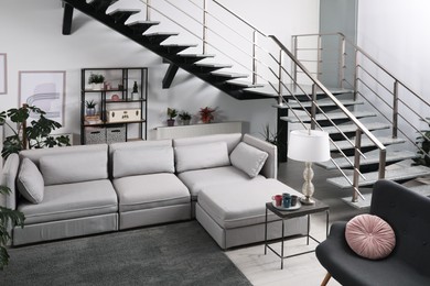 Stylish living room interior with comfortable sofa