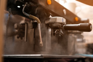Photo of Professional coffee machine with steam wand, closeup