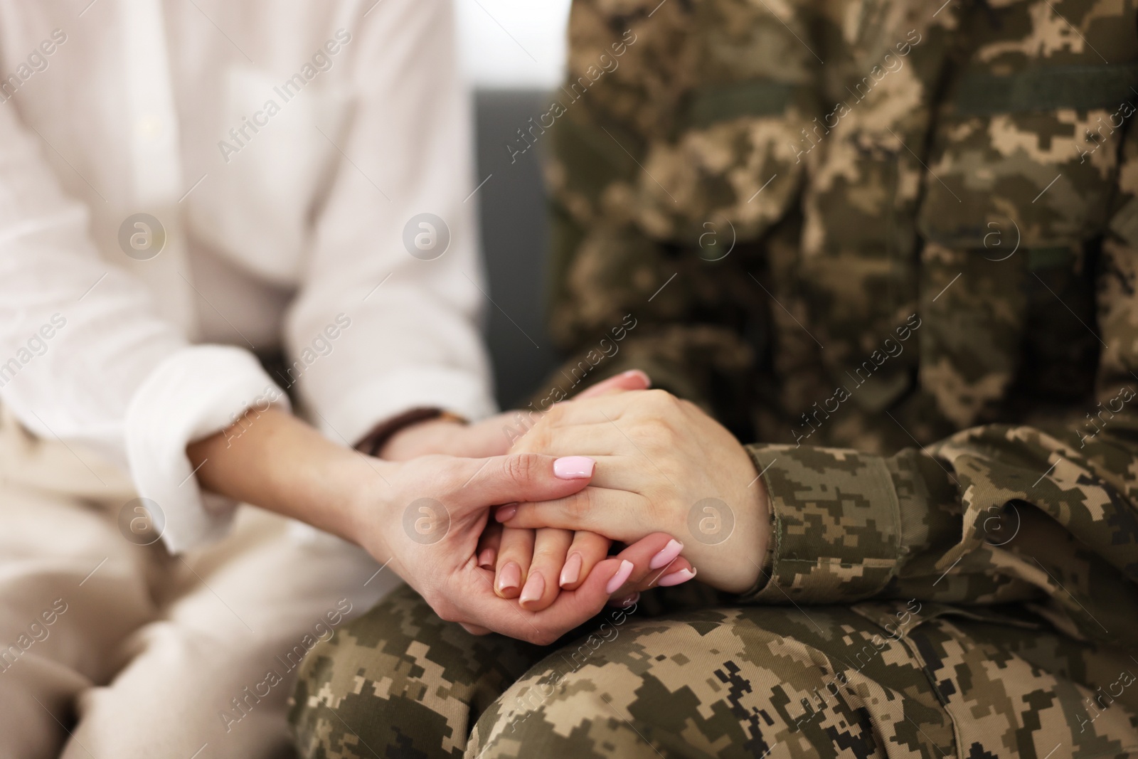 Photo of Psychotherapist working with military woman in office, closeup