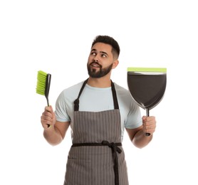 Photo of Young man with brush and dustpan on white background