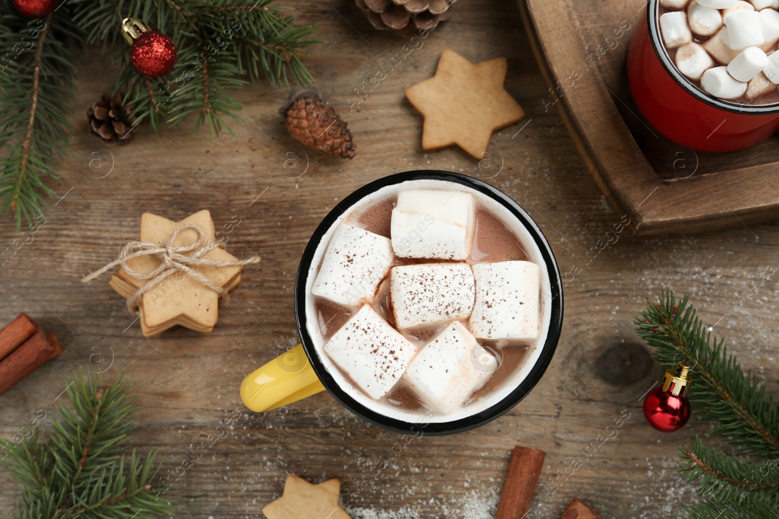 Photo of Flat lay composition with delicious marshmallow cocoa and Christmas decor on wooden table