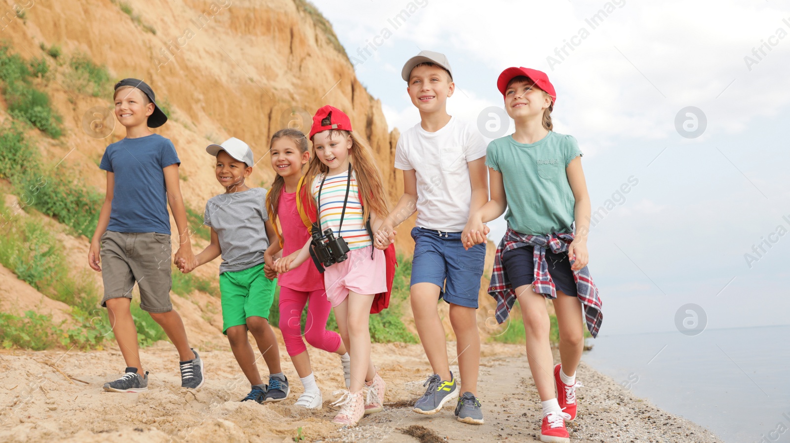 Photo of Cute little children outdoors on summer day. Camping trip