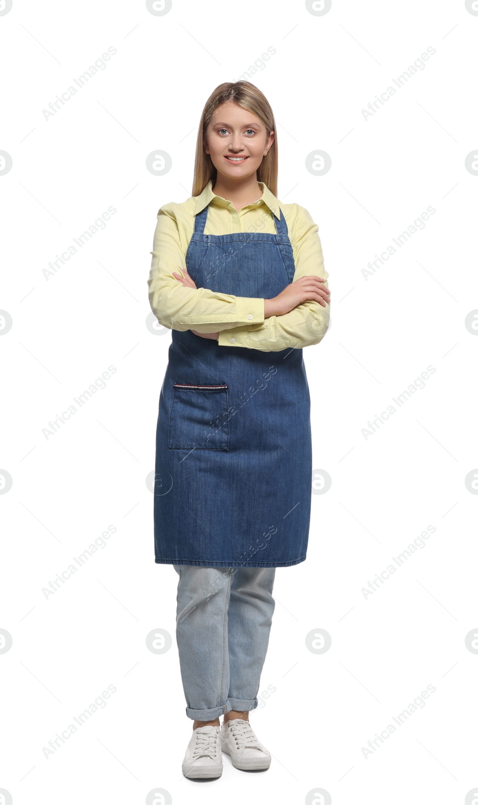 Photo of Beautiful young woman in denim apron on white background