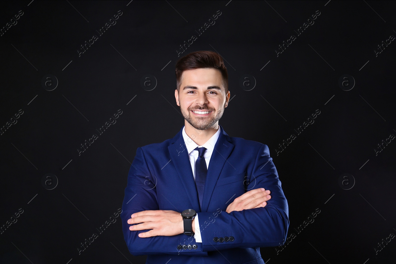 Photo of Portrait of handsome man on black background