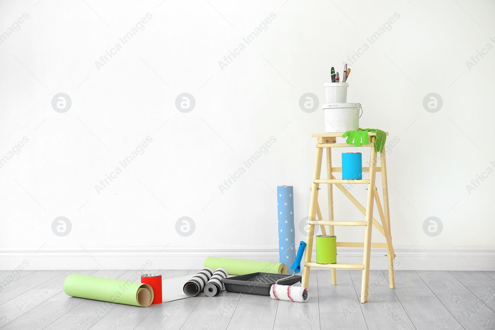 Photo of Decorator's tools near white wall