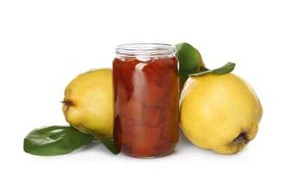 Delicious quince jam and fruits isolated on white