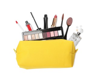 Stylish yellow cosmetic bag with makeup products on white background, top view