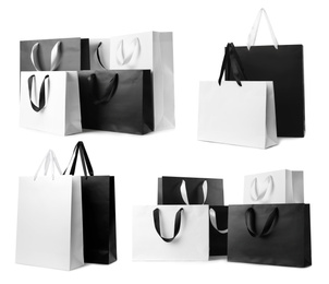 Set with different paper shopping bags on white background