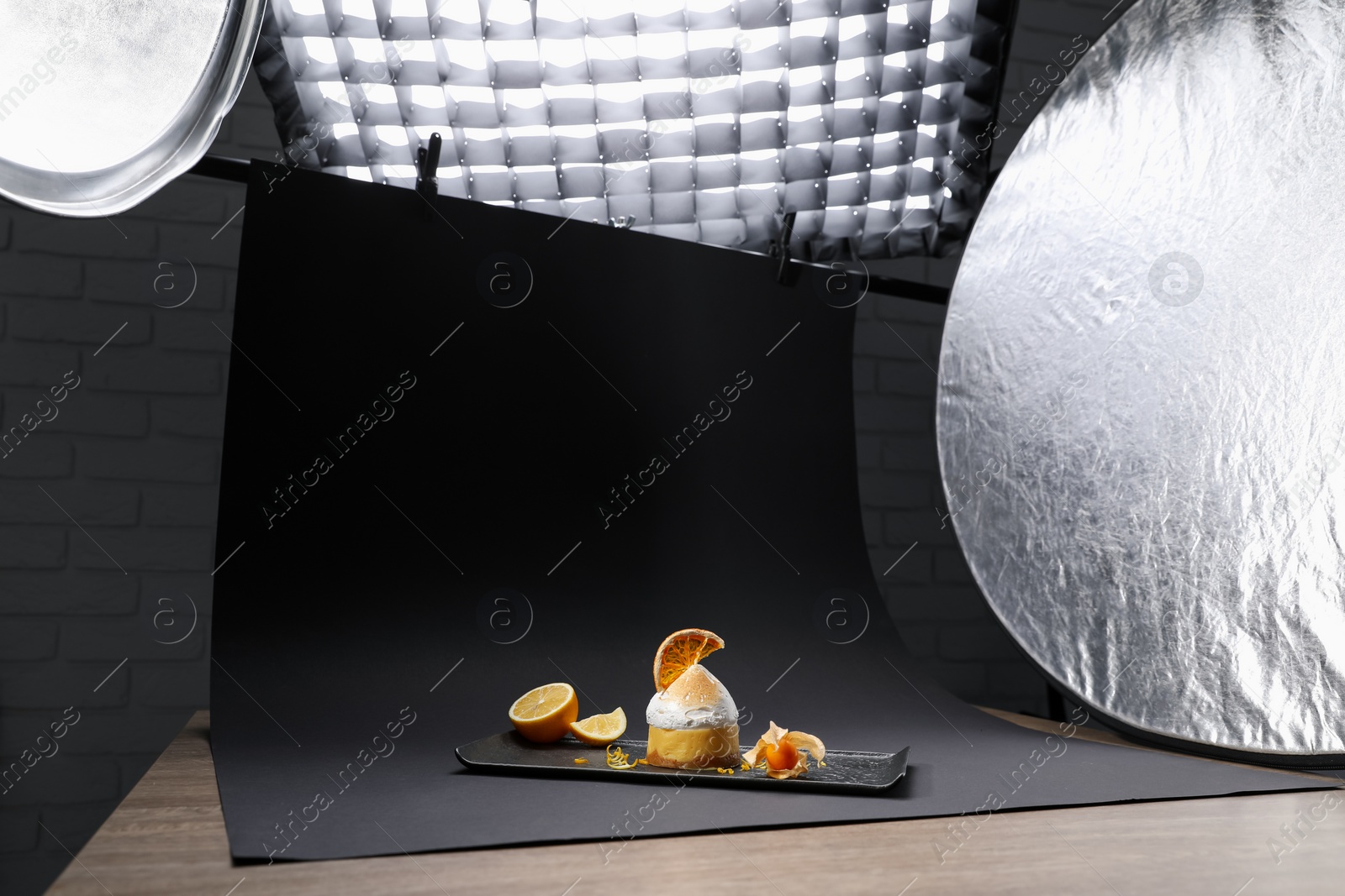 Photo of Beautiful composition with delicious dessert on black background in studio. Food photography