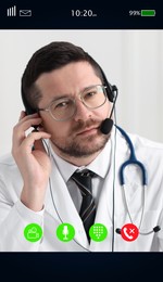 Image of Online medical consultation. Doctor with headset working via video chat application