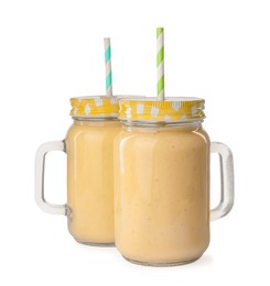 Tasty banana smoothie with straws on white background