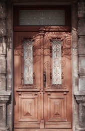 Closed vintage wooden door in old building