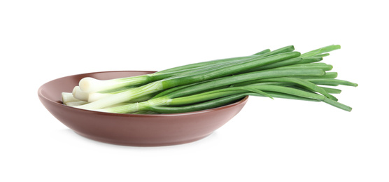 Fresh green spring onions isolated on white