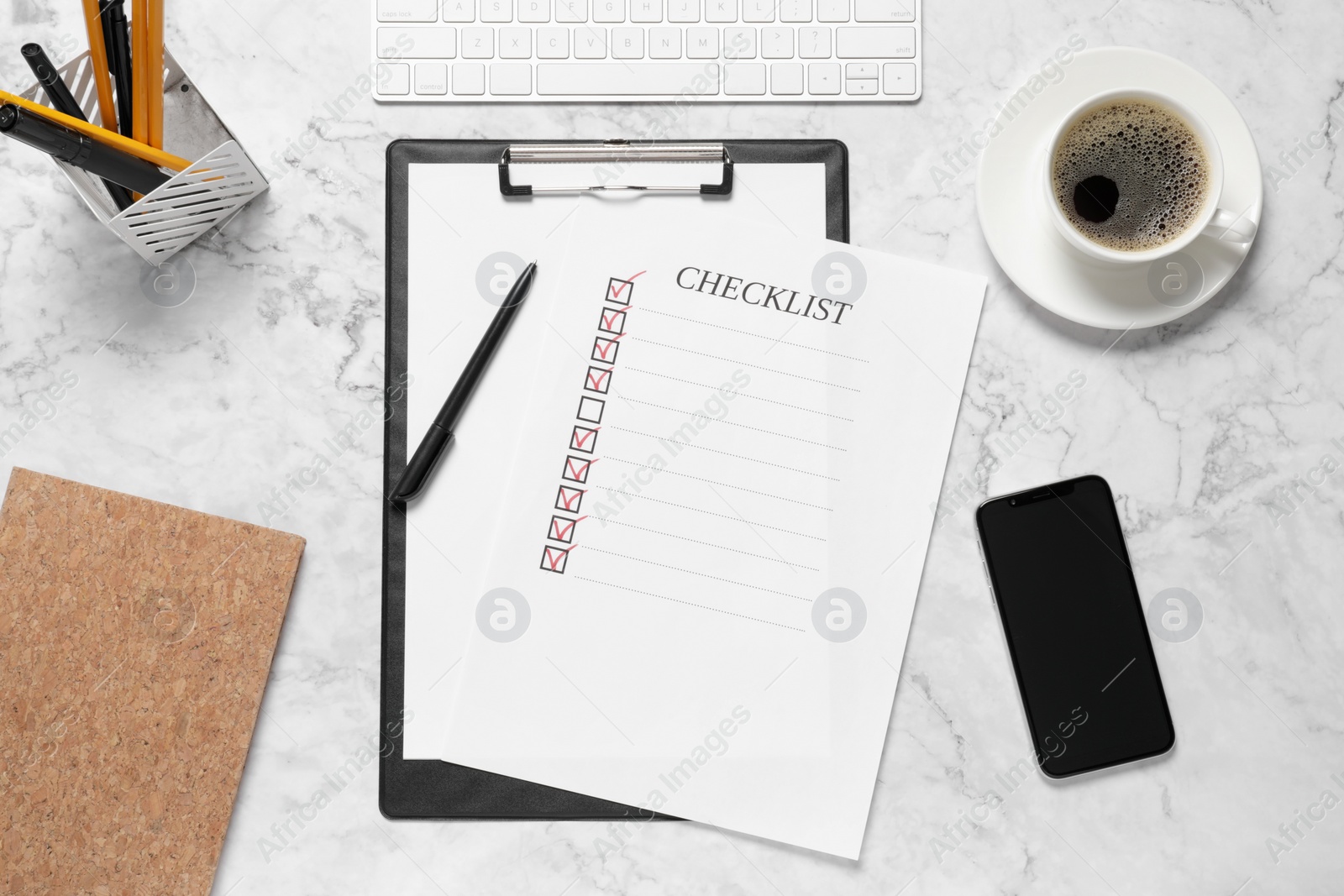 Photo of Clipboard with inscription Checklist, cup of coffee, smartphone and computer keyboard on white marble table, flat lay