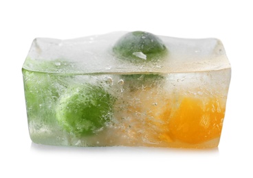 Photo of Corn grains and green peas in ice cube on white background. Frozen vegetables