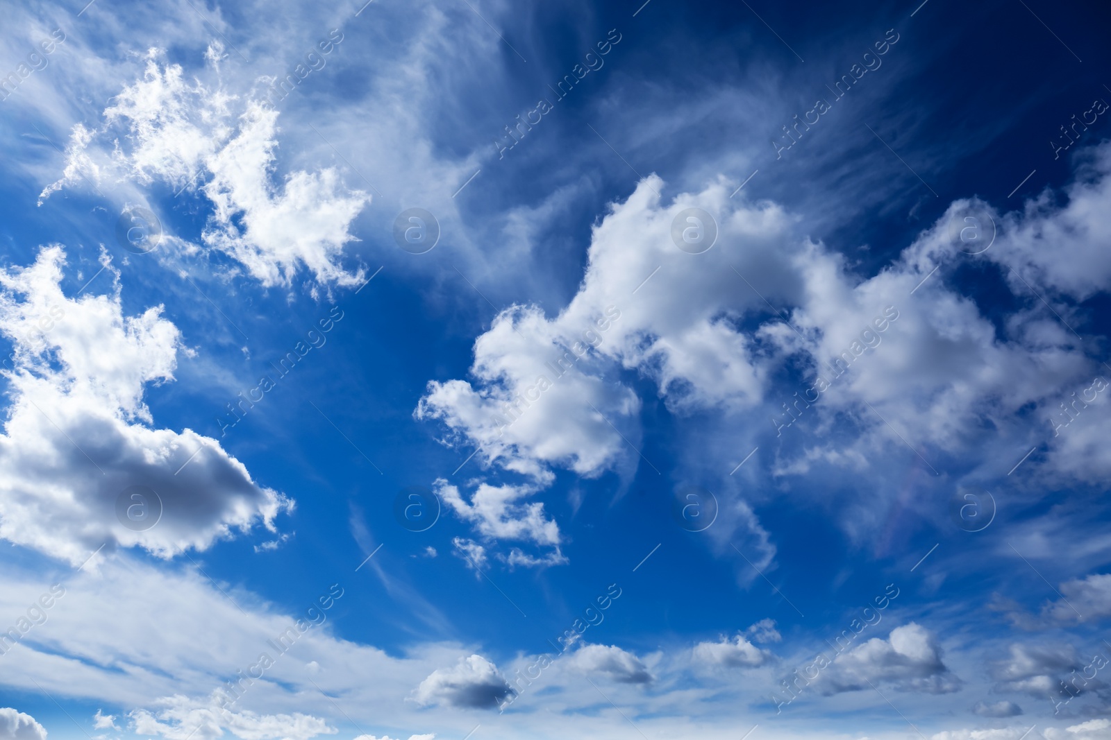 Photo of Picturesque blue sky with white clouds on sunny day