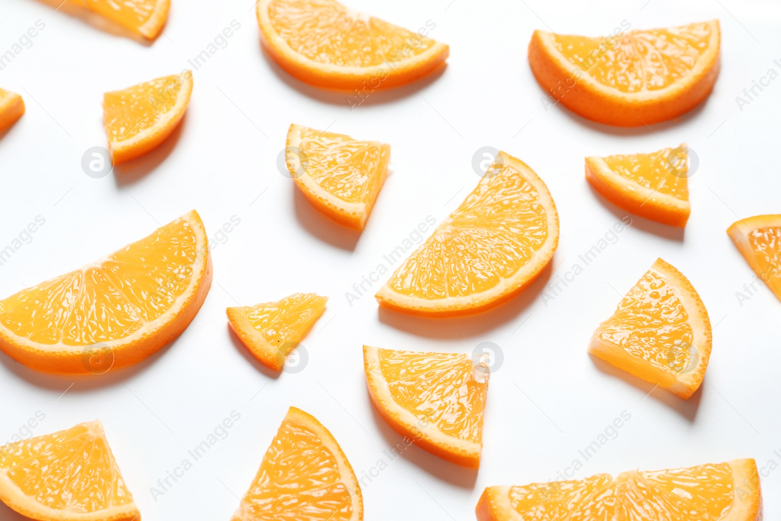 Photo of Composition with orange slices on white background