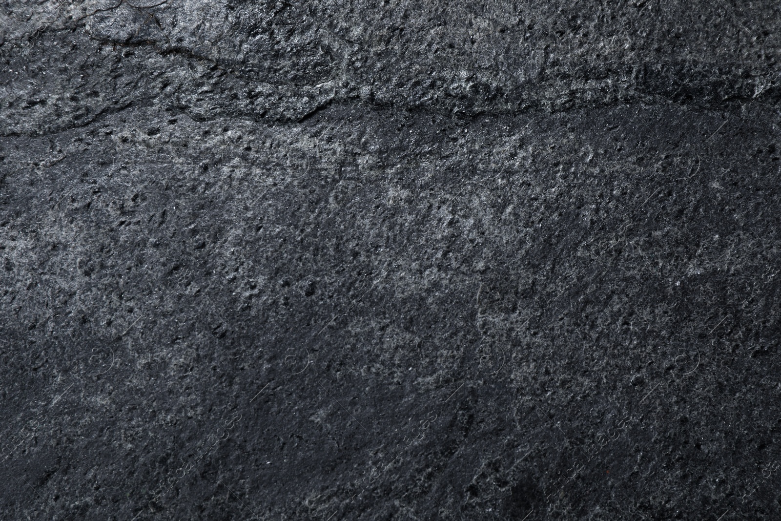 Image of Texture of dark grey stone surface as background, closeup