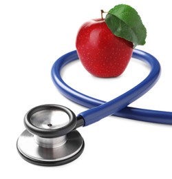 Image of Stethoscope and red apple on white background 