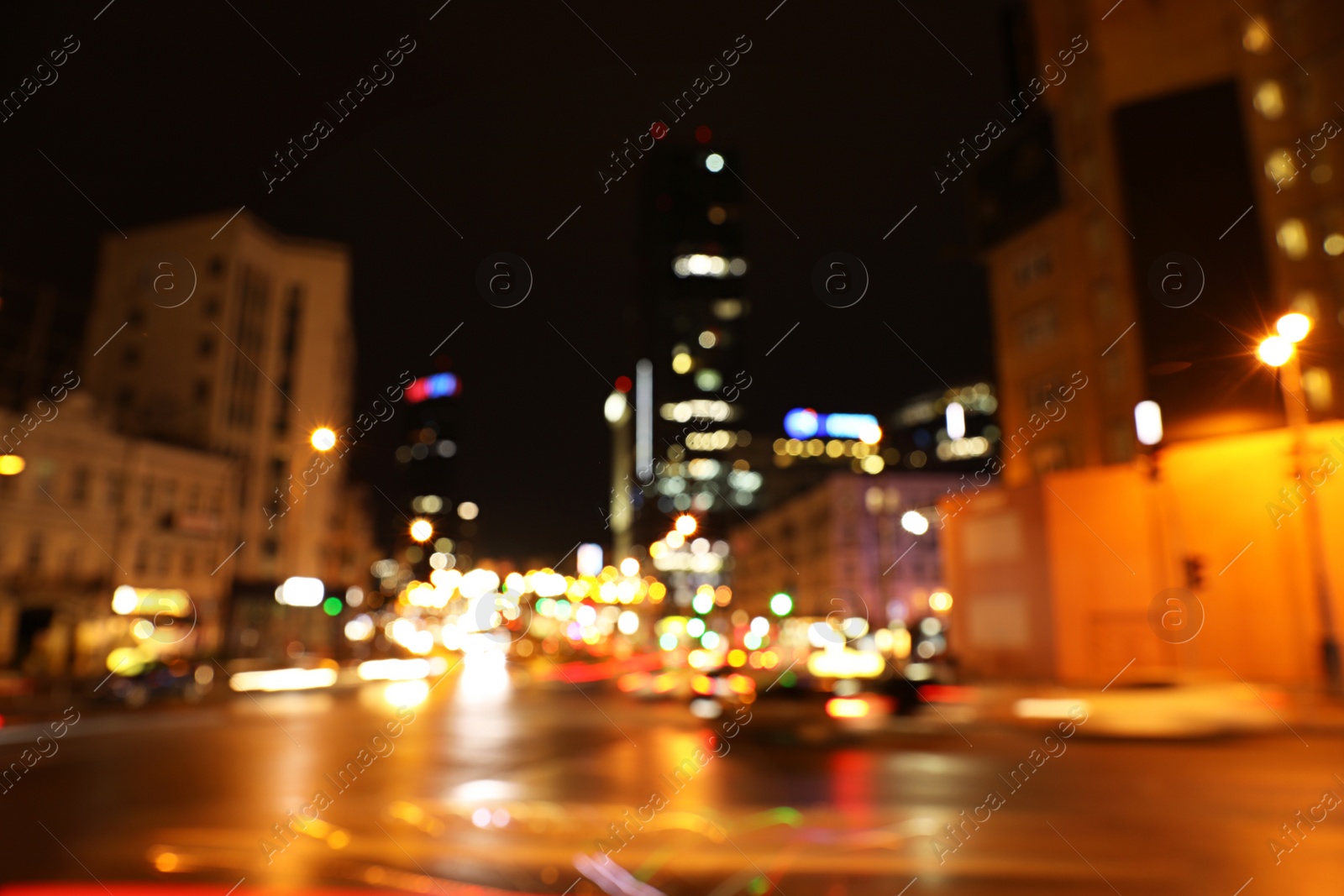 Photo of Blurred view of night cityscape with bokeh effect