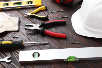 Photo of Different modern construction tools on wooden background